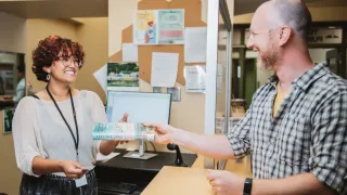 Library staff assisting library user