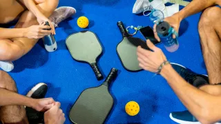 Pickleball team sitting together