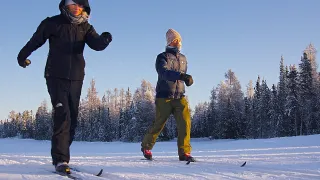 Two people skiing on the lake 