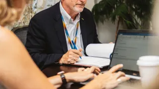 City Manager Stephen Van Dine reading a report