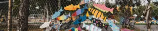 Fish art on a park fence