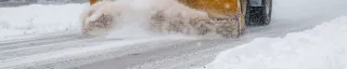 Winter Road cleaning with heavy machine