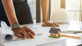 An architect drafting a floor plan