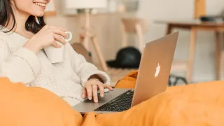 a lady using a macbook