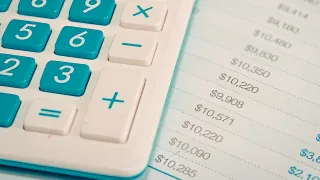 a calculator and numbers sheet