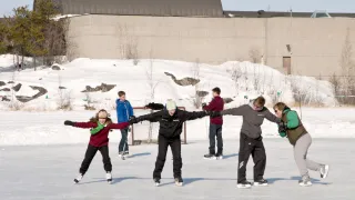 Four women skating on the ice