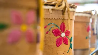 Birchbark baskets with a red flower design